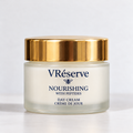 A jar of VRéserve Nourishing with Peptides Day Cream, featuring a frosted glass container, a shiny gold lid, and navy blue text on a clean white background.