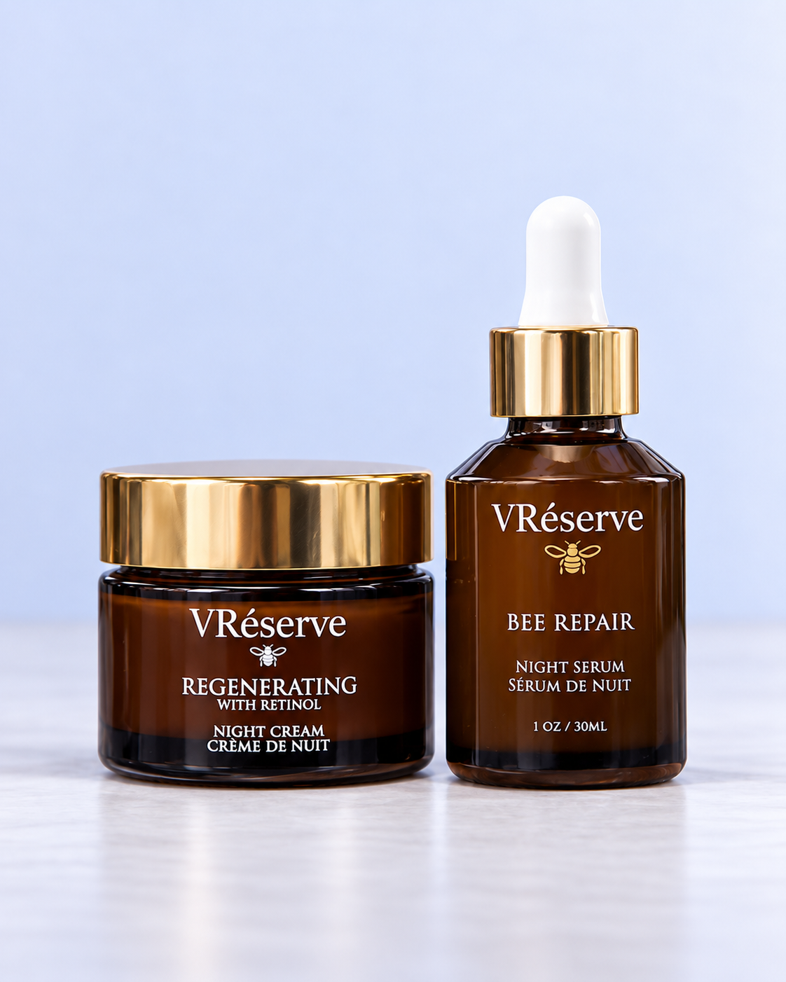 VRéserve Bee Repair Night Serum next to Night cream in studio background.